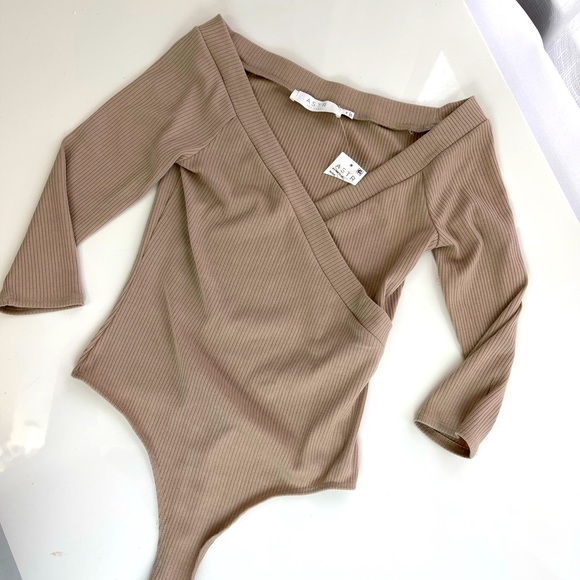 Astr Tops - ASTR THE LABEL nude THONG BODYSUIT New layer piece ribbed V neck long sleeves M